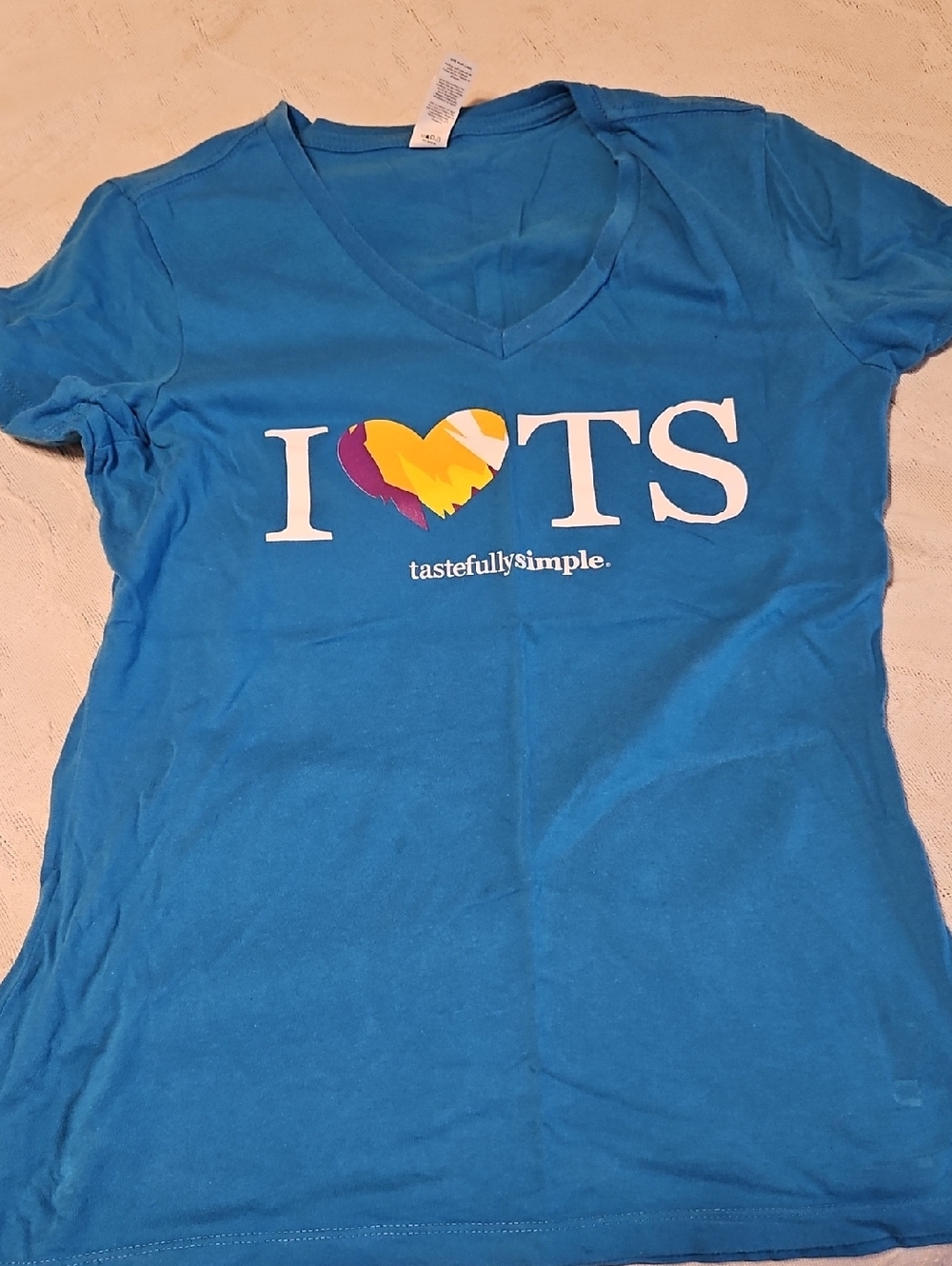 Set Of Shirts With Tastefully Simple Logo On Them